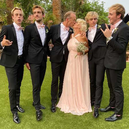 Stormie Lynch and her husband Mark Lynch took a picture with their four sons at a wedding.